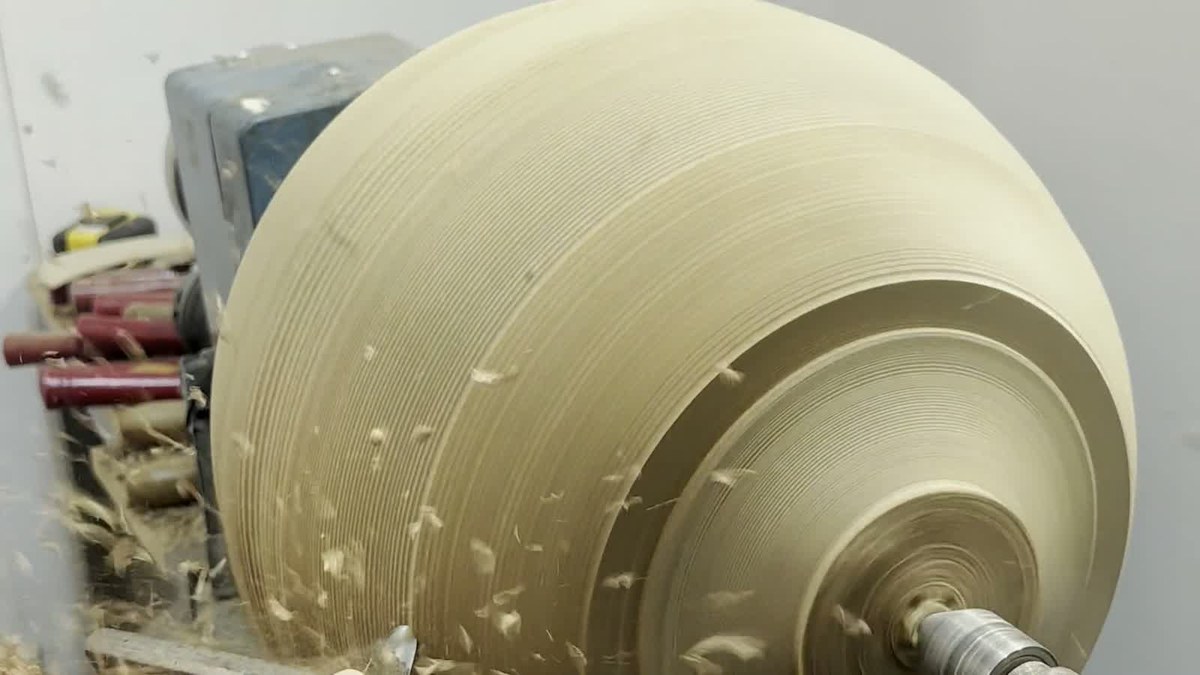 A large turned timber form on the lathe