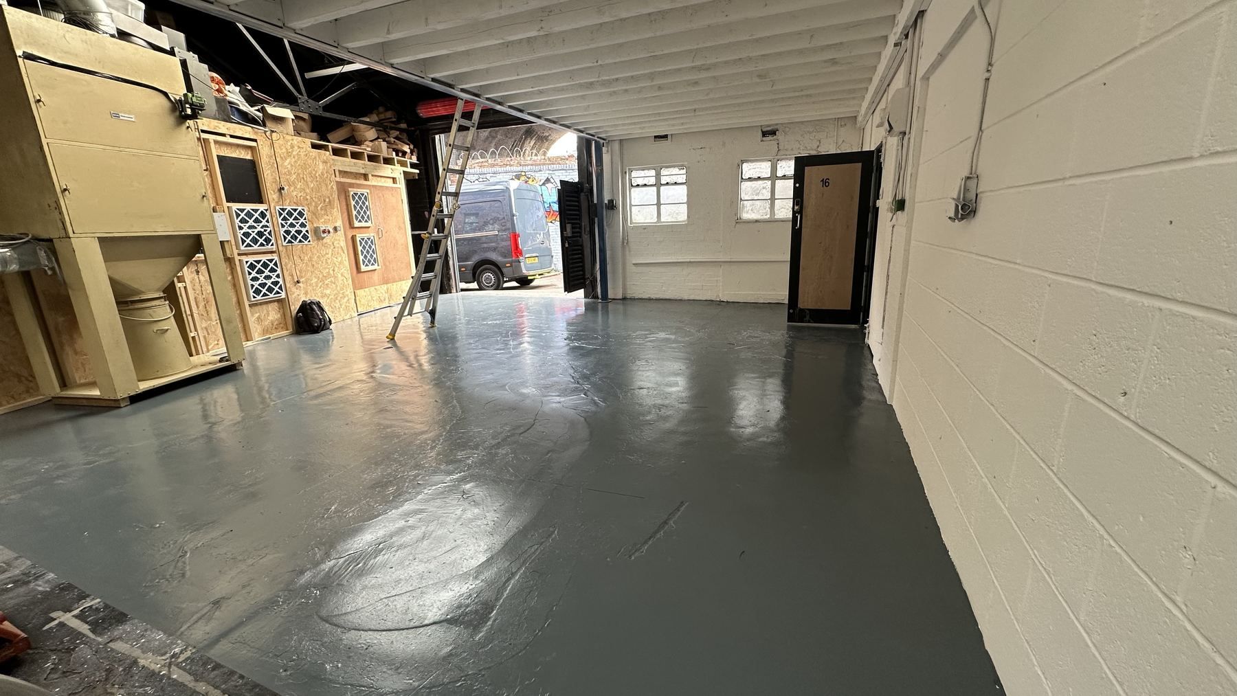 The clean bay at Milk Street, painted floor and roller door