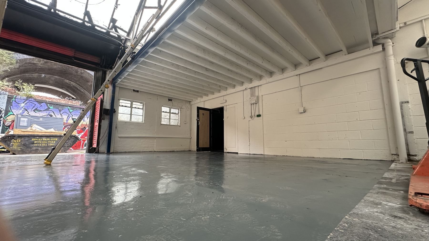 The clean bay with daylight from the open roller door