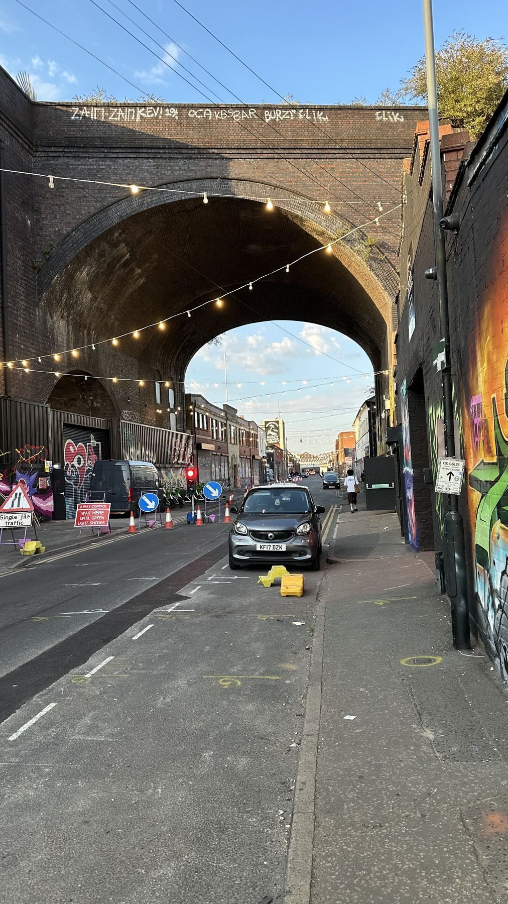 Railway arch over Milk Street, painted walls either side