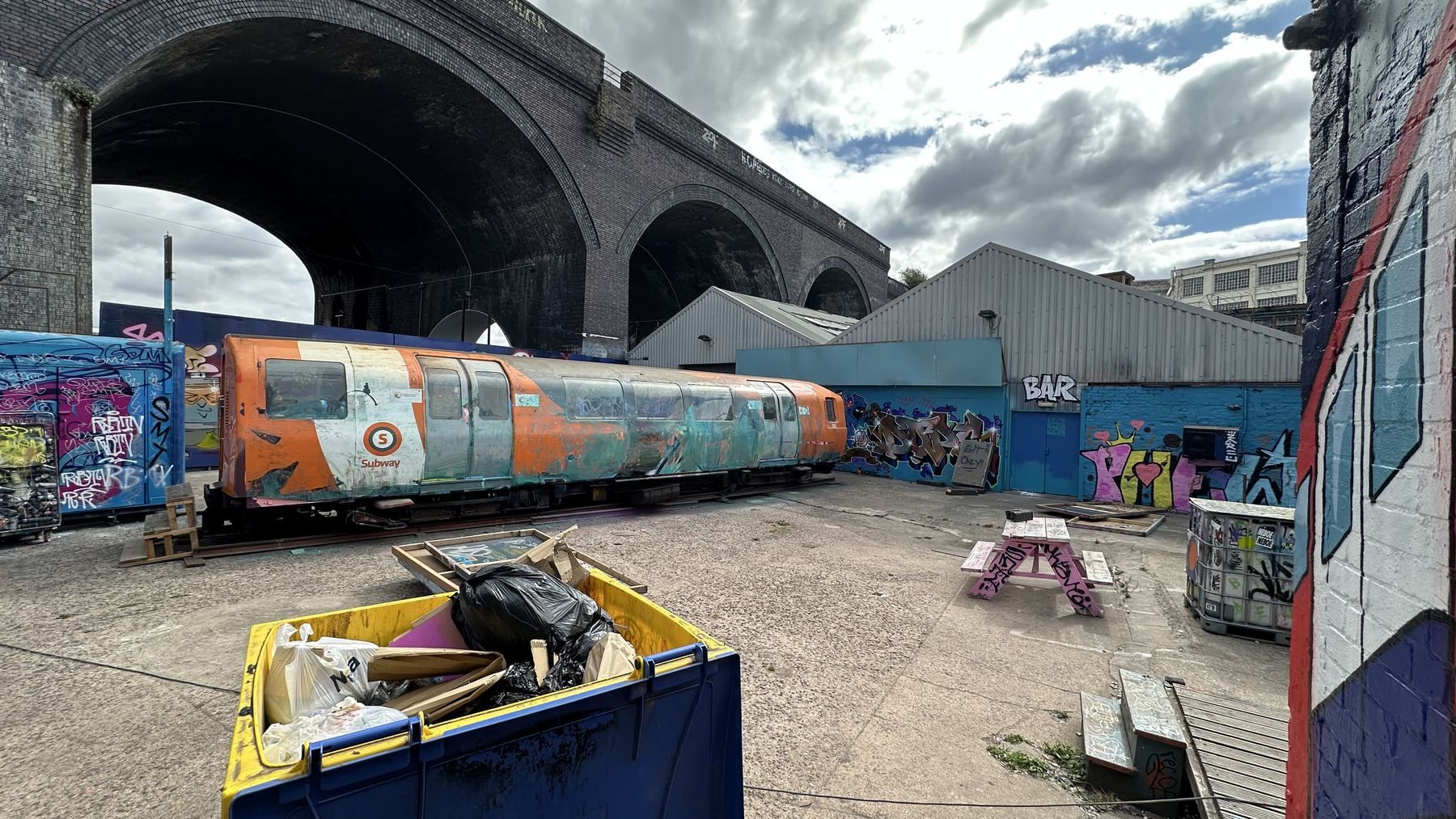The yard beside the factory under the railway arches